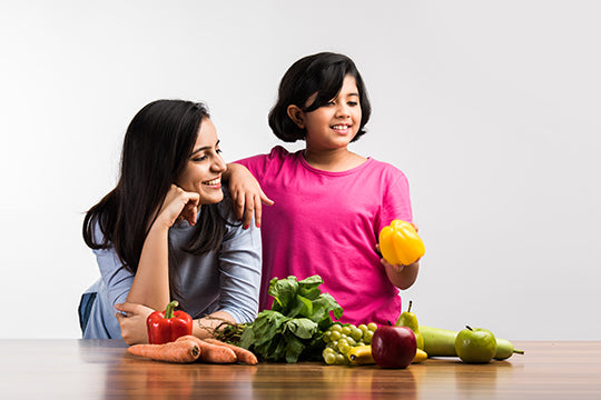 Mom and child look at healthy foods