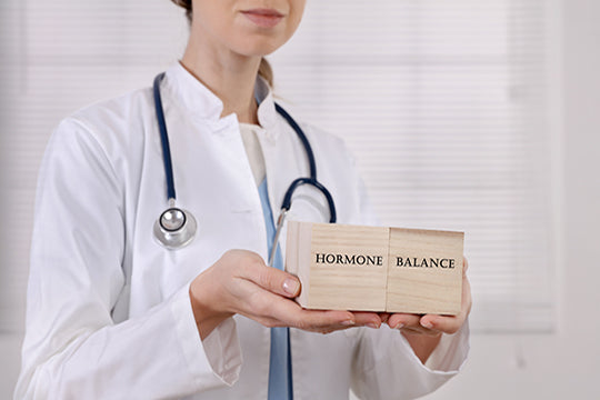 doctor holds hormones sign