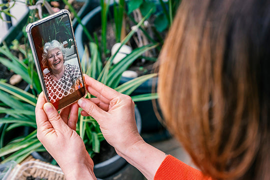 woman calls mom on video phone