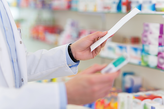 pharmacist fills prescription